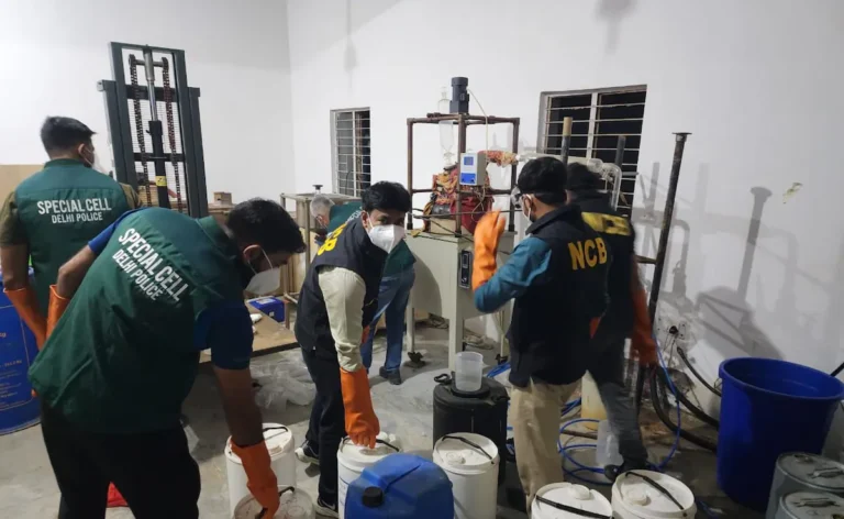 Delhi police dismantling a meth lab run by students in Greater Noida, with equipment and chemicals seized, marking a significant crackdown on urban drug networks.