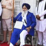 A tense moment outside the Golden Temple in Amritsar as Shiromani Akali Dal leader Sukhbir Singh Badal, seated in a wheelchair, performs penance amidst a security breach involving an attempted shooting.