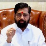 Eknath Shinde, caretaker Chief Minister of Maharashtra, in a hospital setting with medical staff, symbolizing health concerns amidst a backdrop of political discussions.