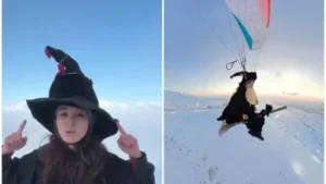 women dressed as witch paraglide with broom stick